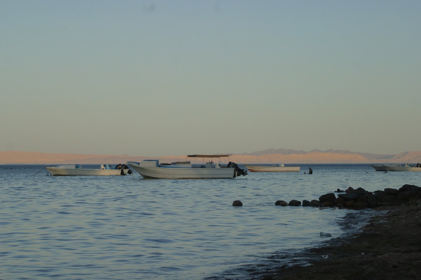 Boats moored at dusk off the Dahab coast